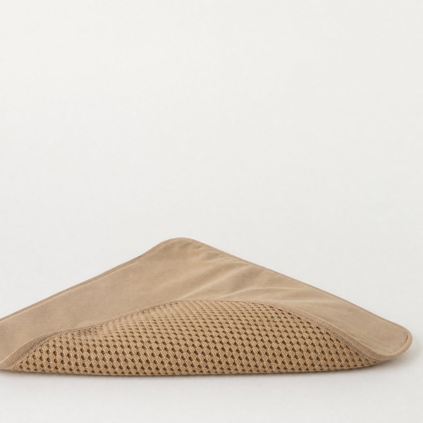 One corner folded back, showing the smooth underside