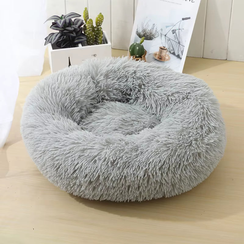 A bright pink plush donut dog bed — supplier photograph 25 of 27