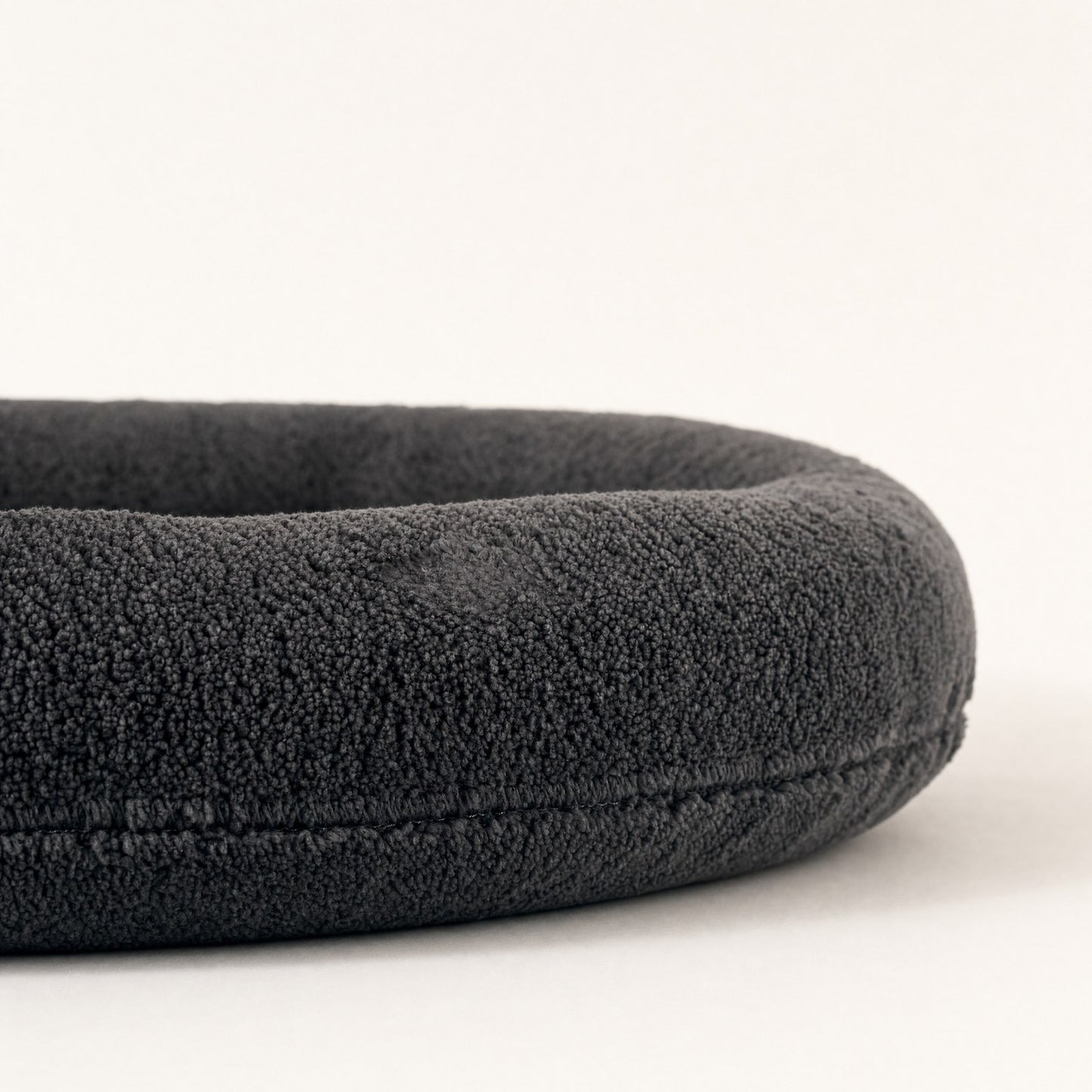 Close-up of the plush pile and the seam that closes the rim