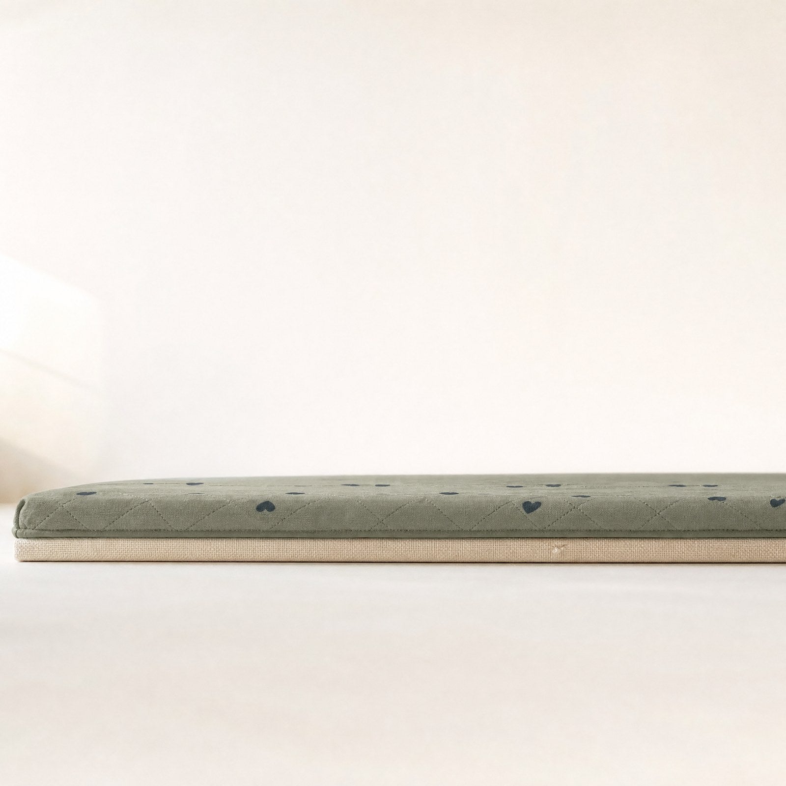 The mat seen at surface level, showing its thin profile