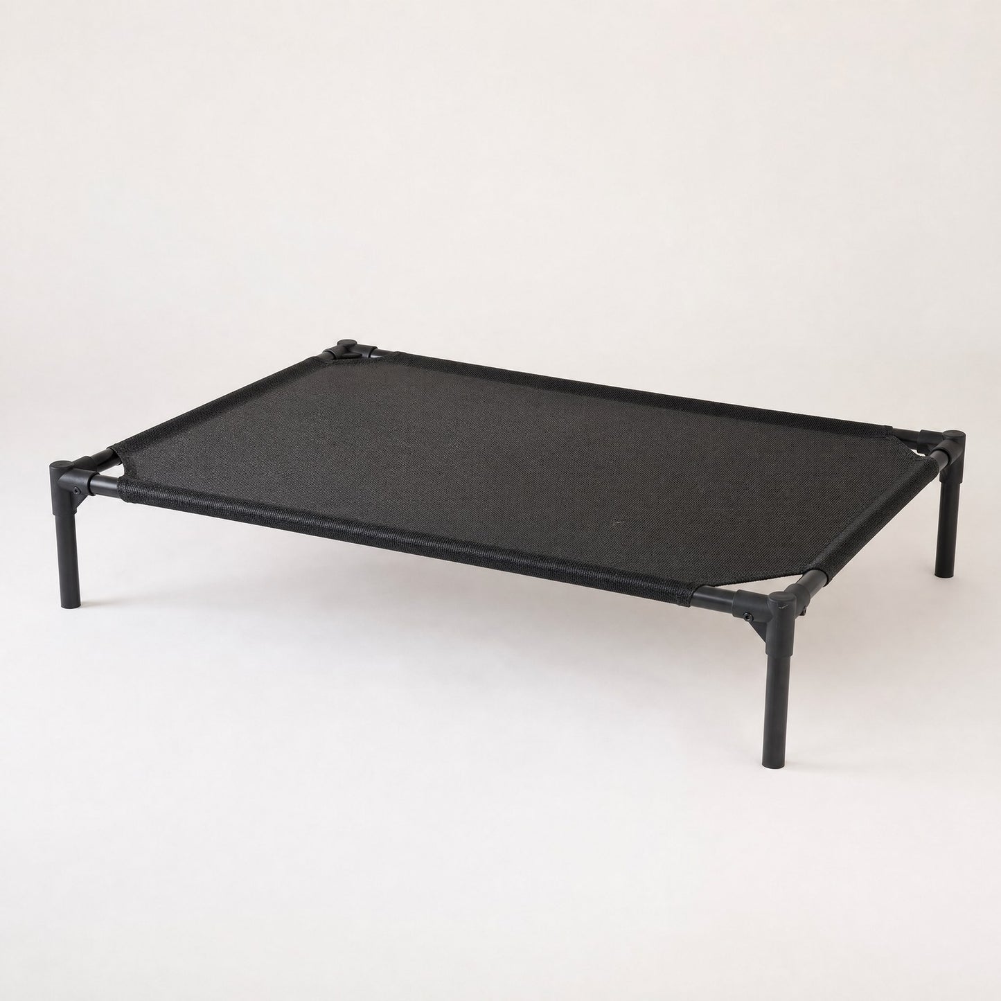 The raised cot seen at an angle, showing the gap underneath