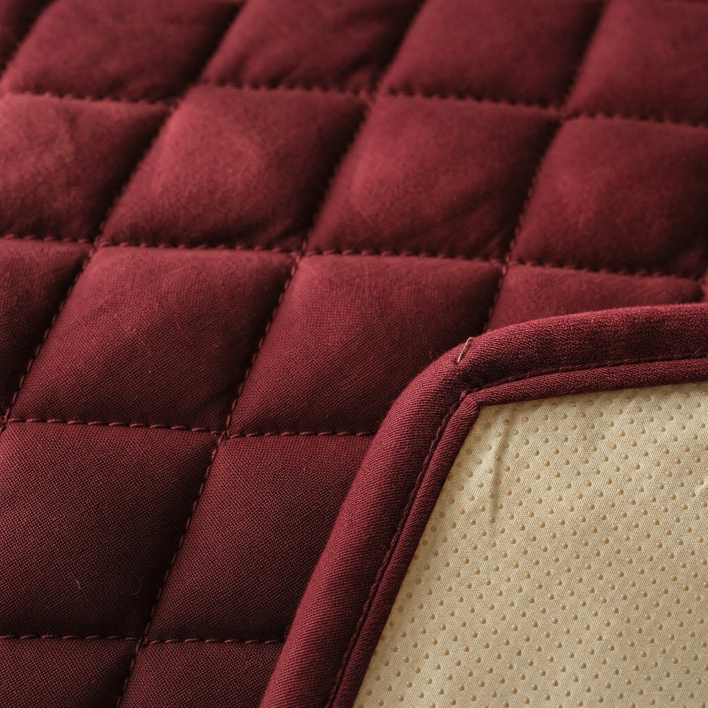 Close-up of the quilting and the cream non-slip backing