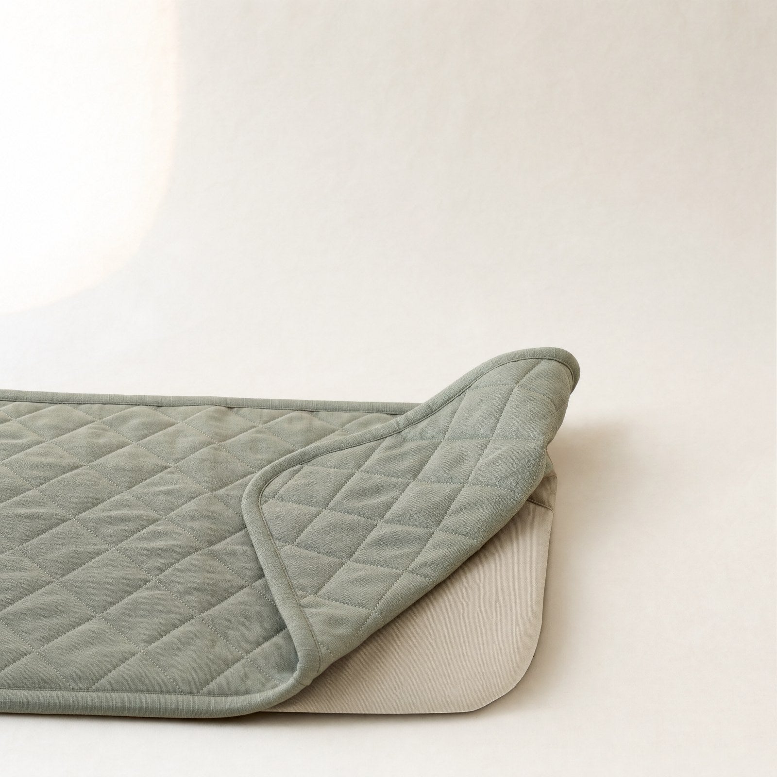 One corner folded back, showing the plain underside