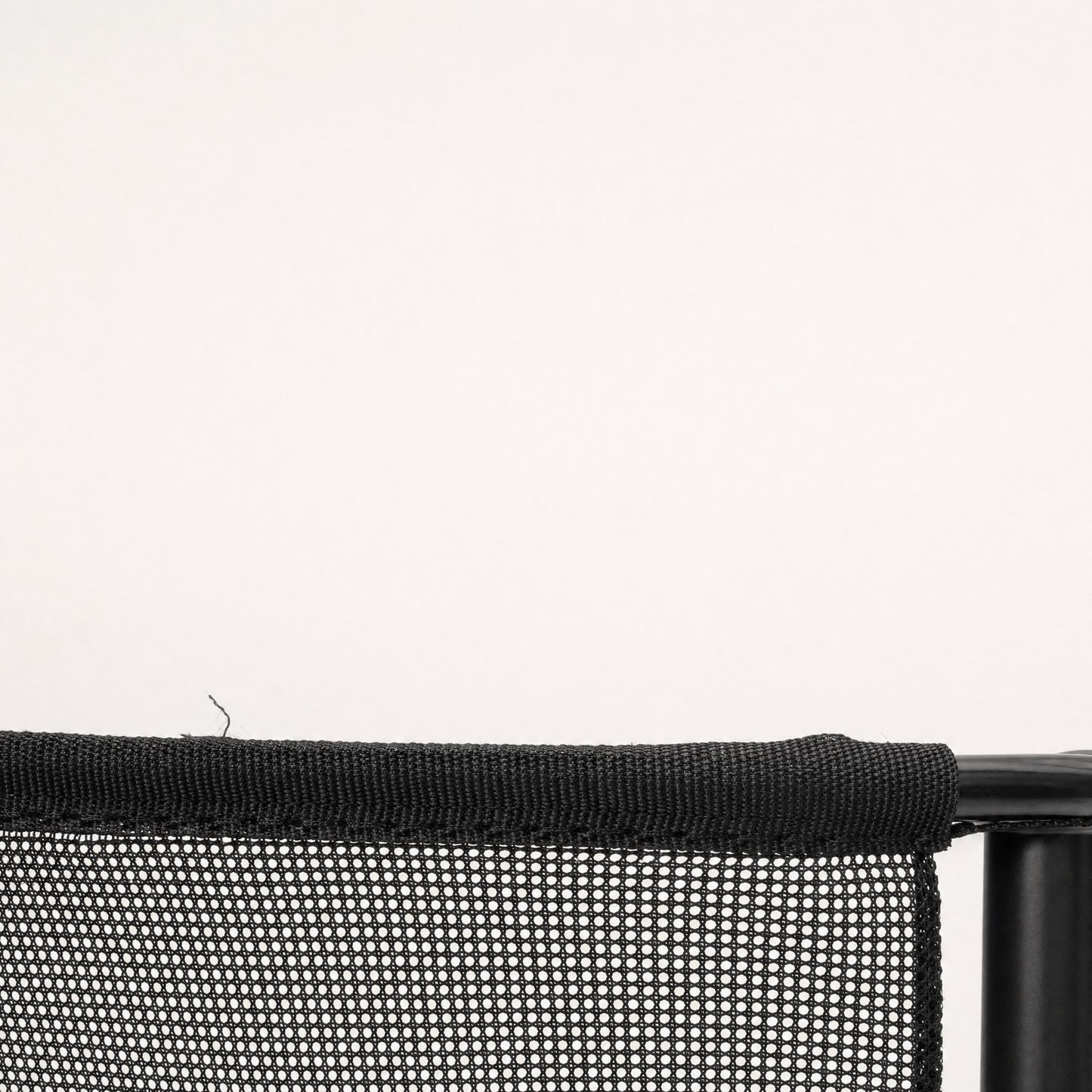 Close-up of the mesh, its open weave and bound edge