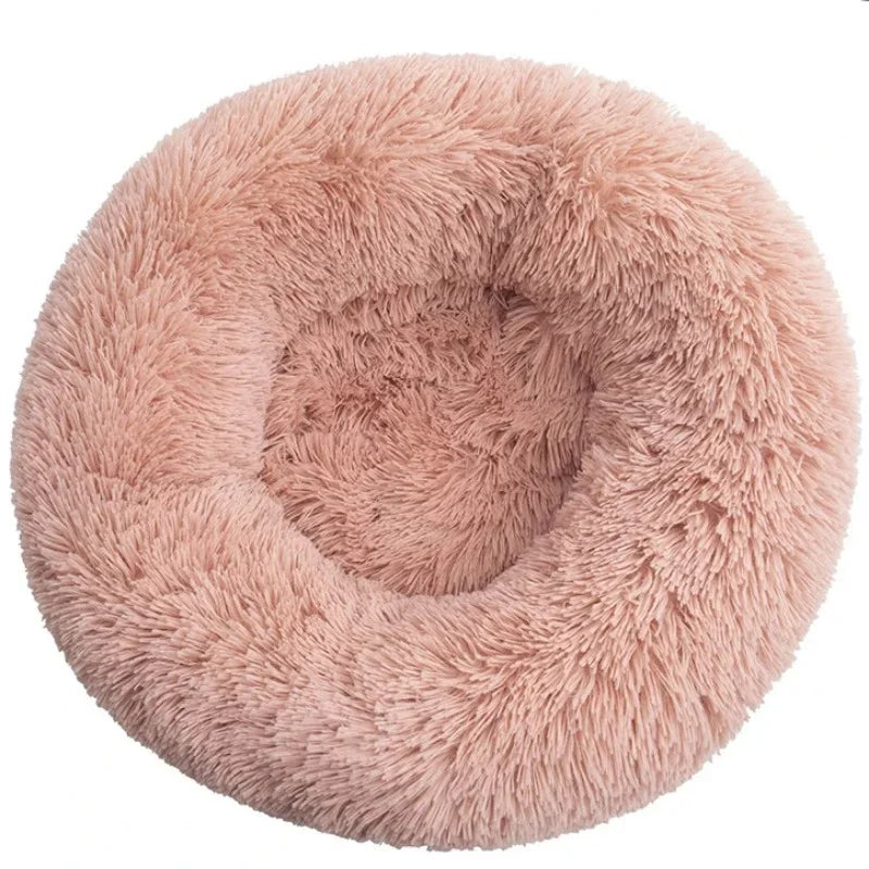 A round dog bed with a raised rim