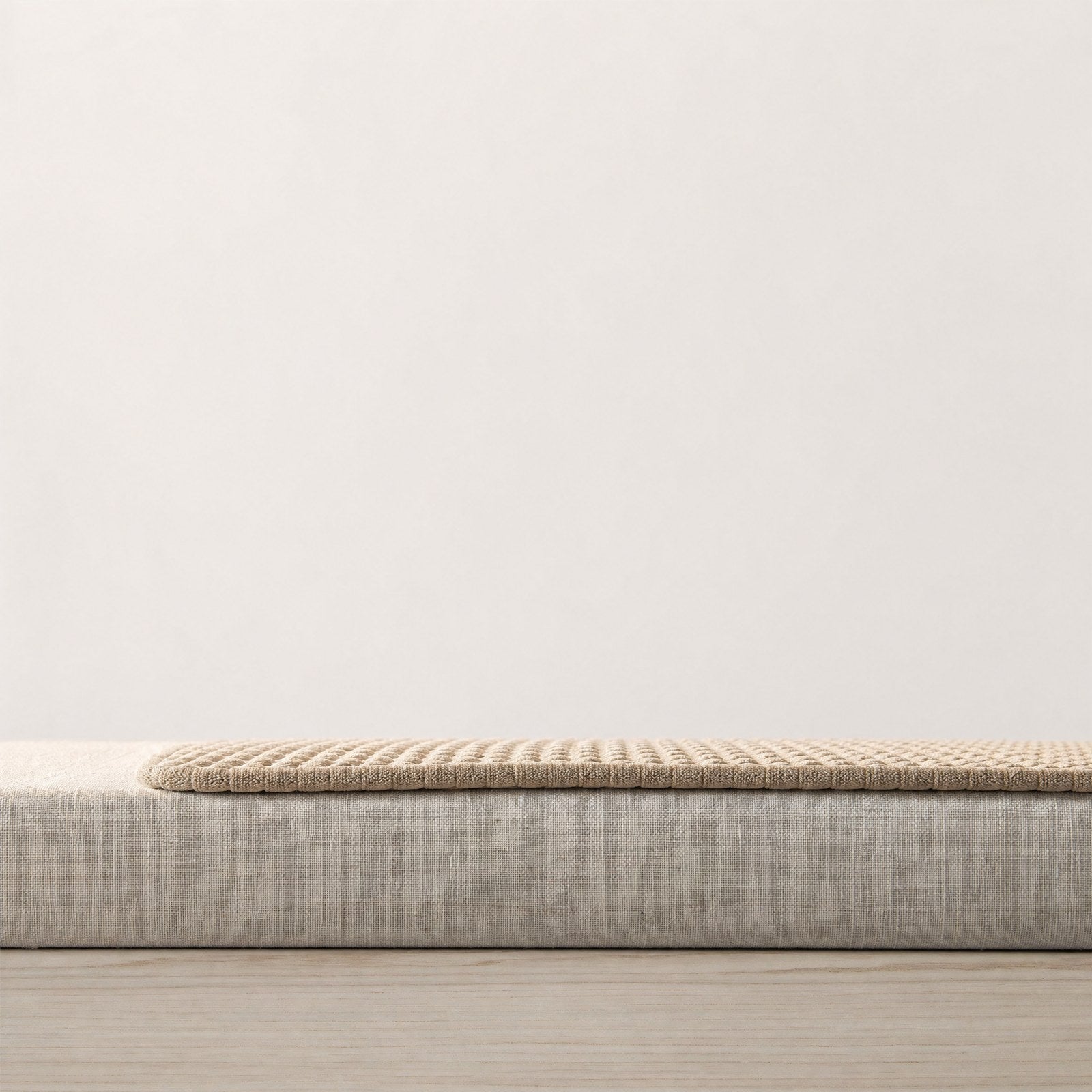 The mat seen at surface level, showing its thin profile