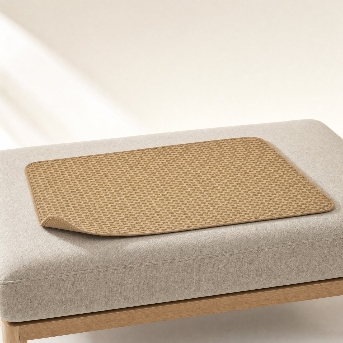 The camel waffle mat seen at an angle, showing its thin profile