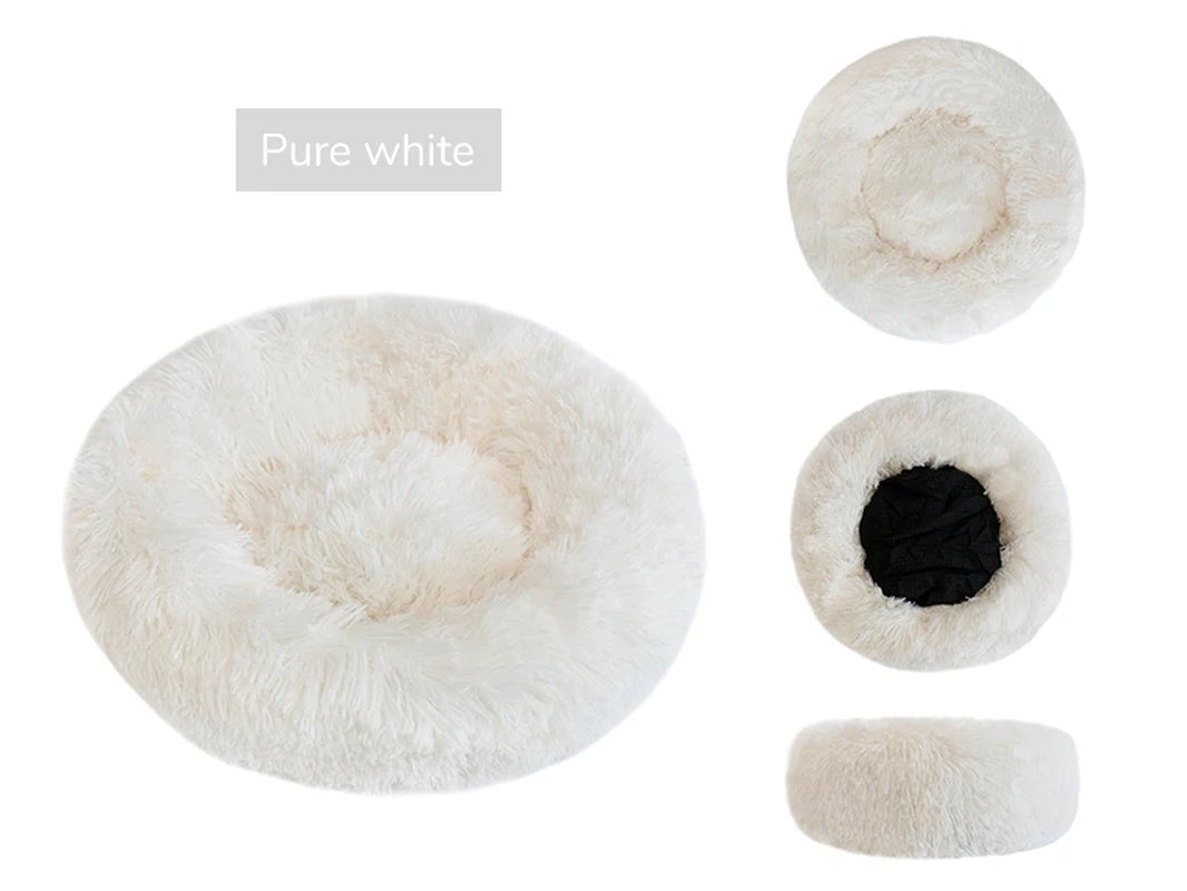 A pure white warming plush donut dog bed