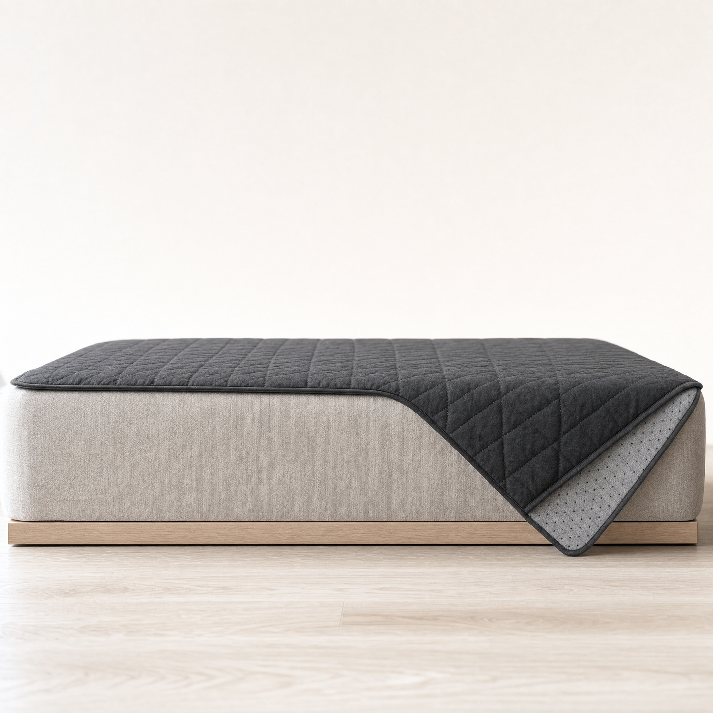 Side view of the cover laid over a seat, hanging over the front edge