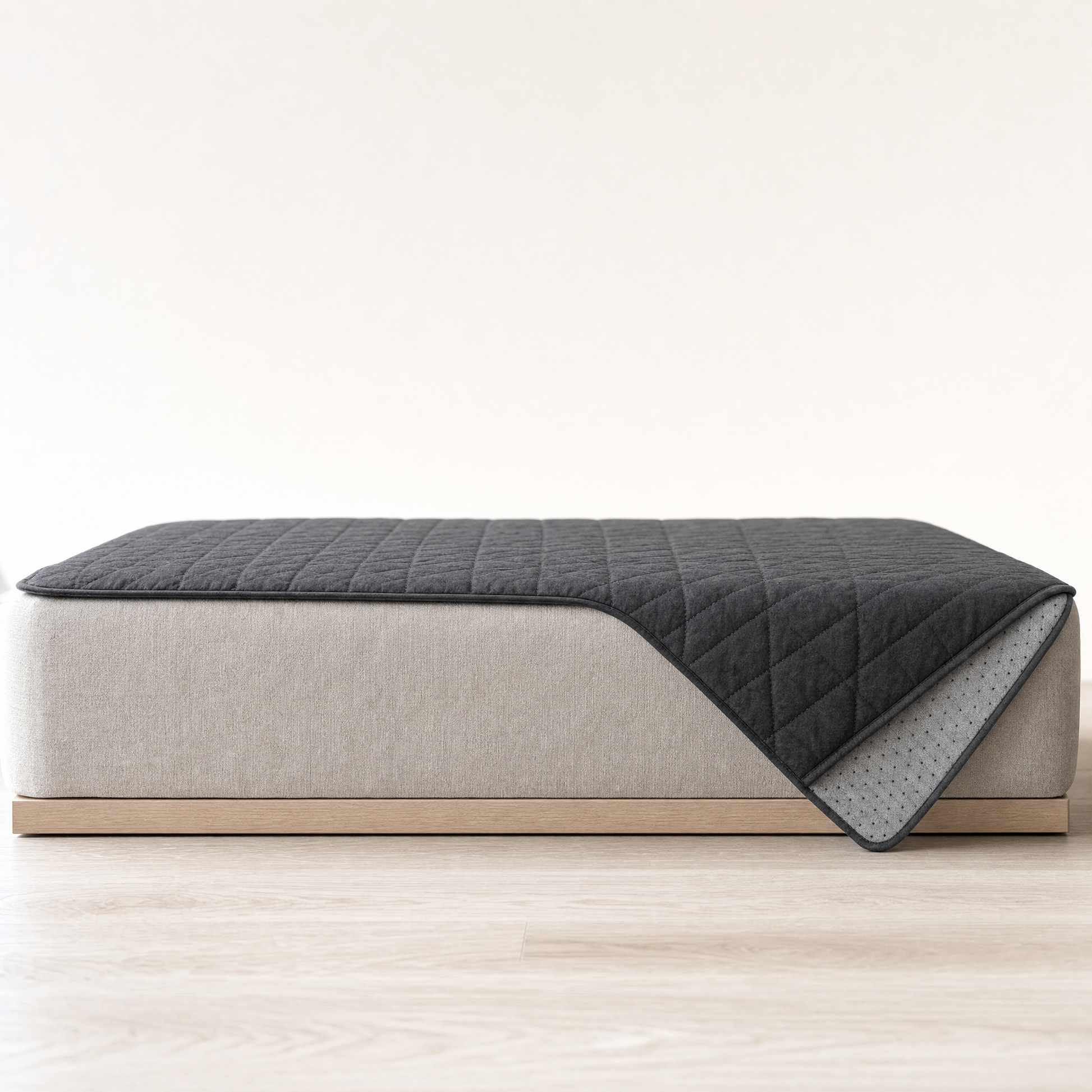 Side view of the cover laid over a seat, hanging over the front edge