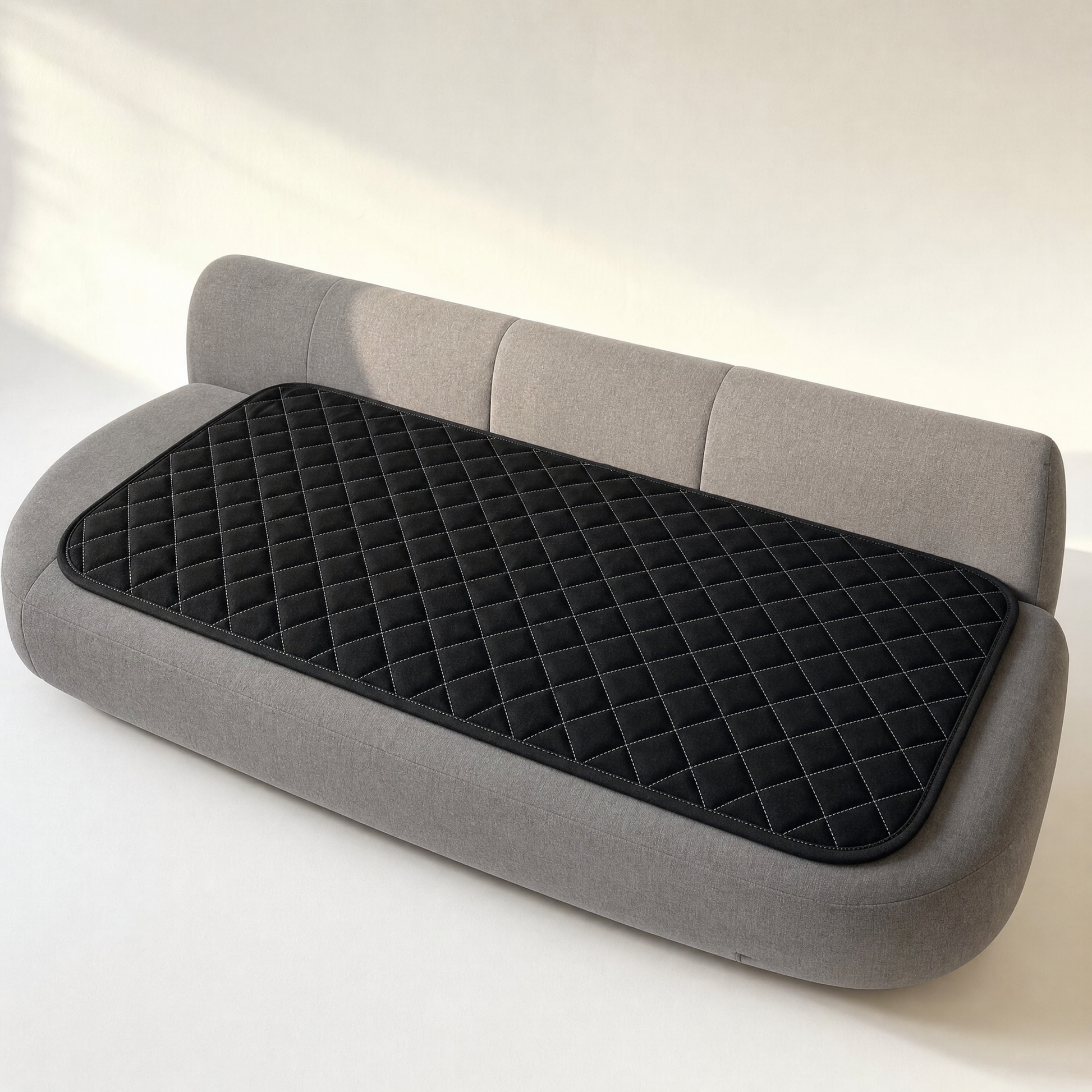 The pad seen at an angle on a bench seat, whole shape visible