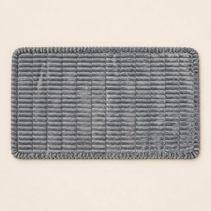Overhead view of the ribbed car-seat bed