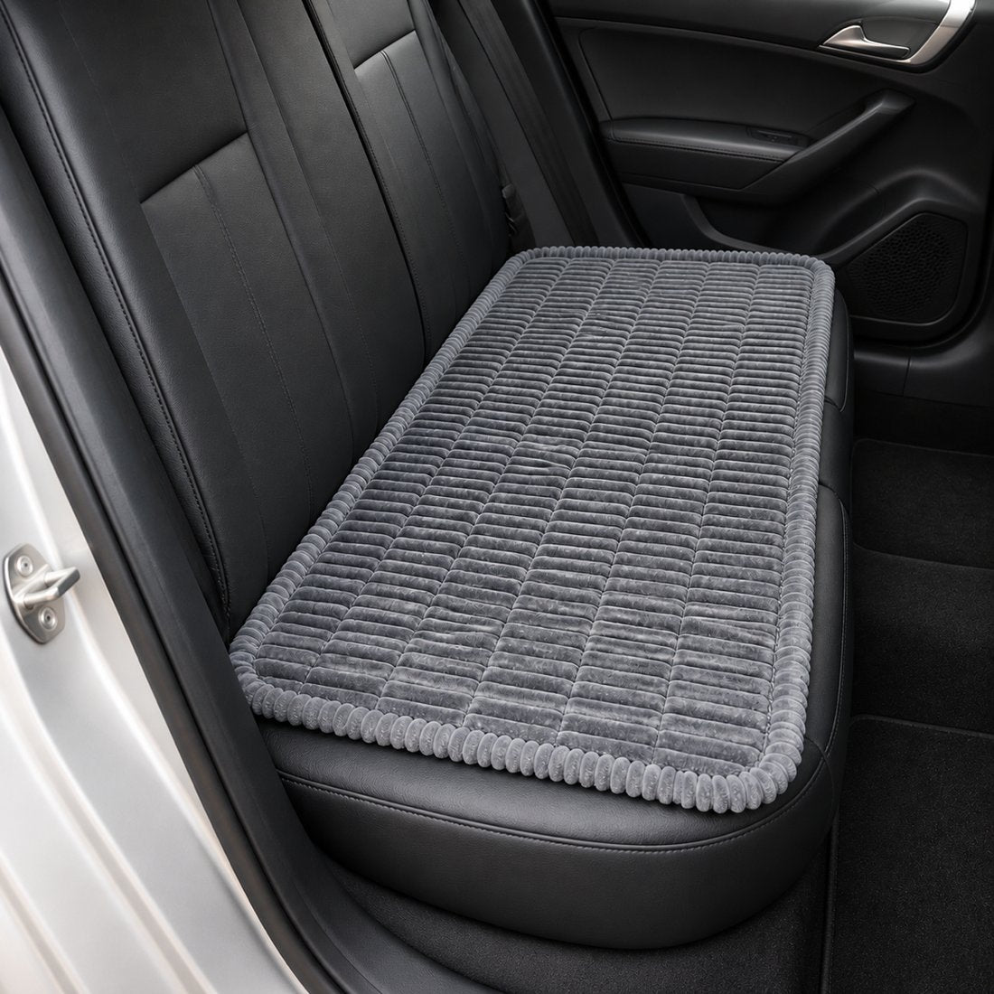 Grey ribbed car-seat dog bed laid across a car back seat